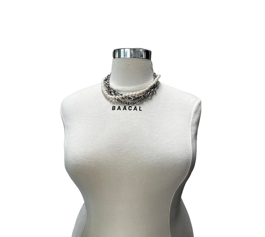 mannequin with pearl and silver necklaces